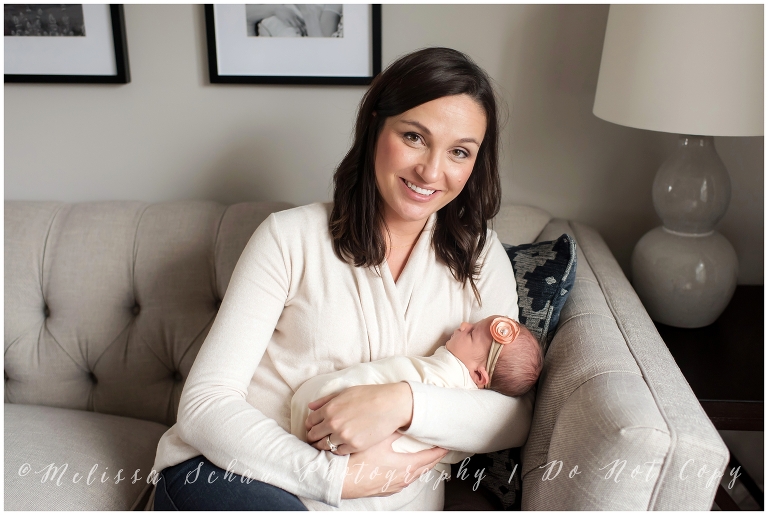Mom holding newborn daughter