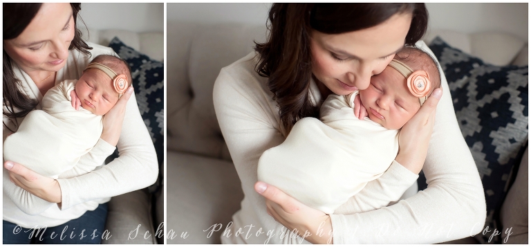 Mother holding newborn daughter