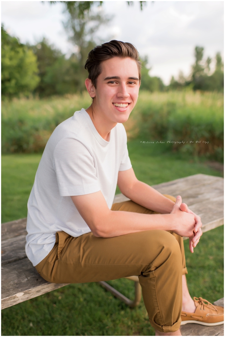 Barrington Illinois senior guy outdoor photography session sitting on table