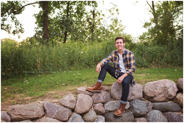 Barrington Illinois high school senior guy sitting on rocks outdoor photography session
