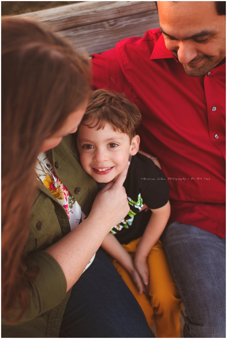 Boy with parents outdoor photo session