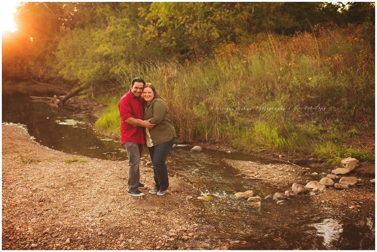Mom and dad at creek for family photography session