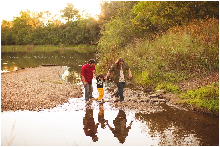 family walking in creek for family outdoor photography session