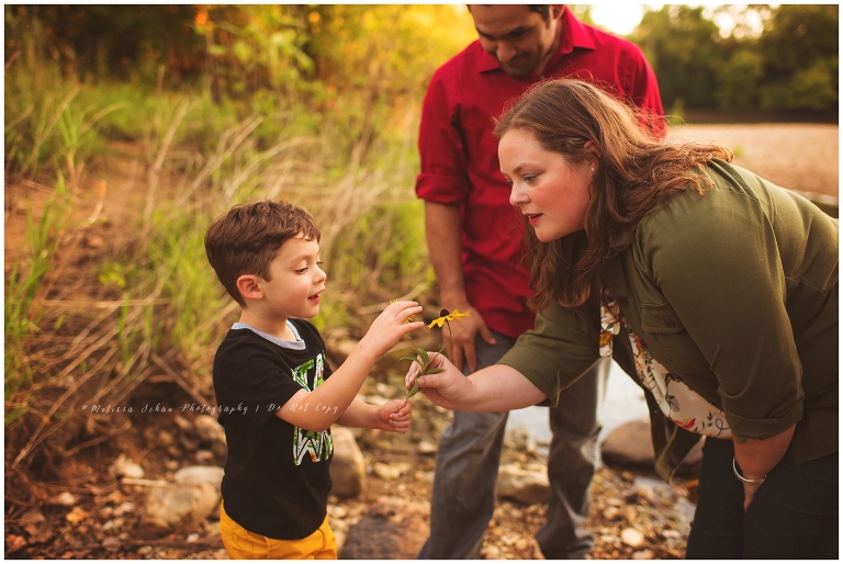 boy giving mom flower creek photography session