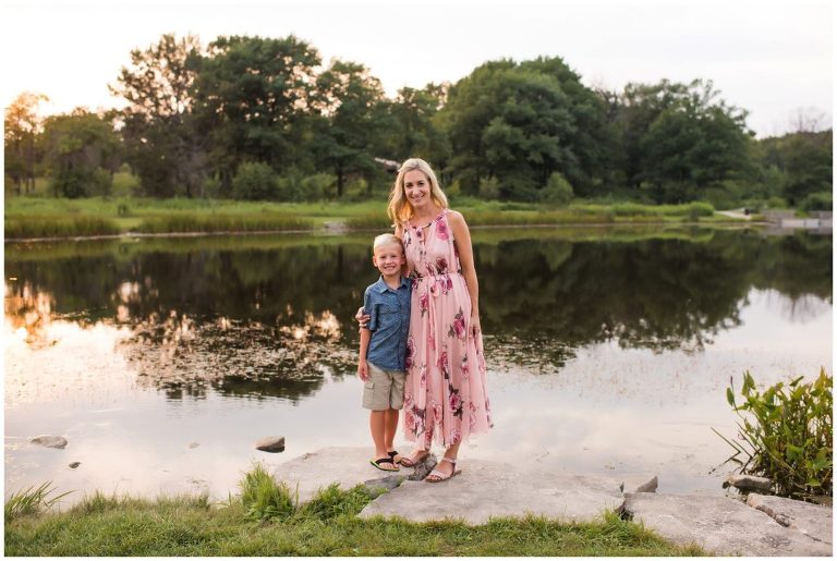 Mother and son family portrait near water