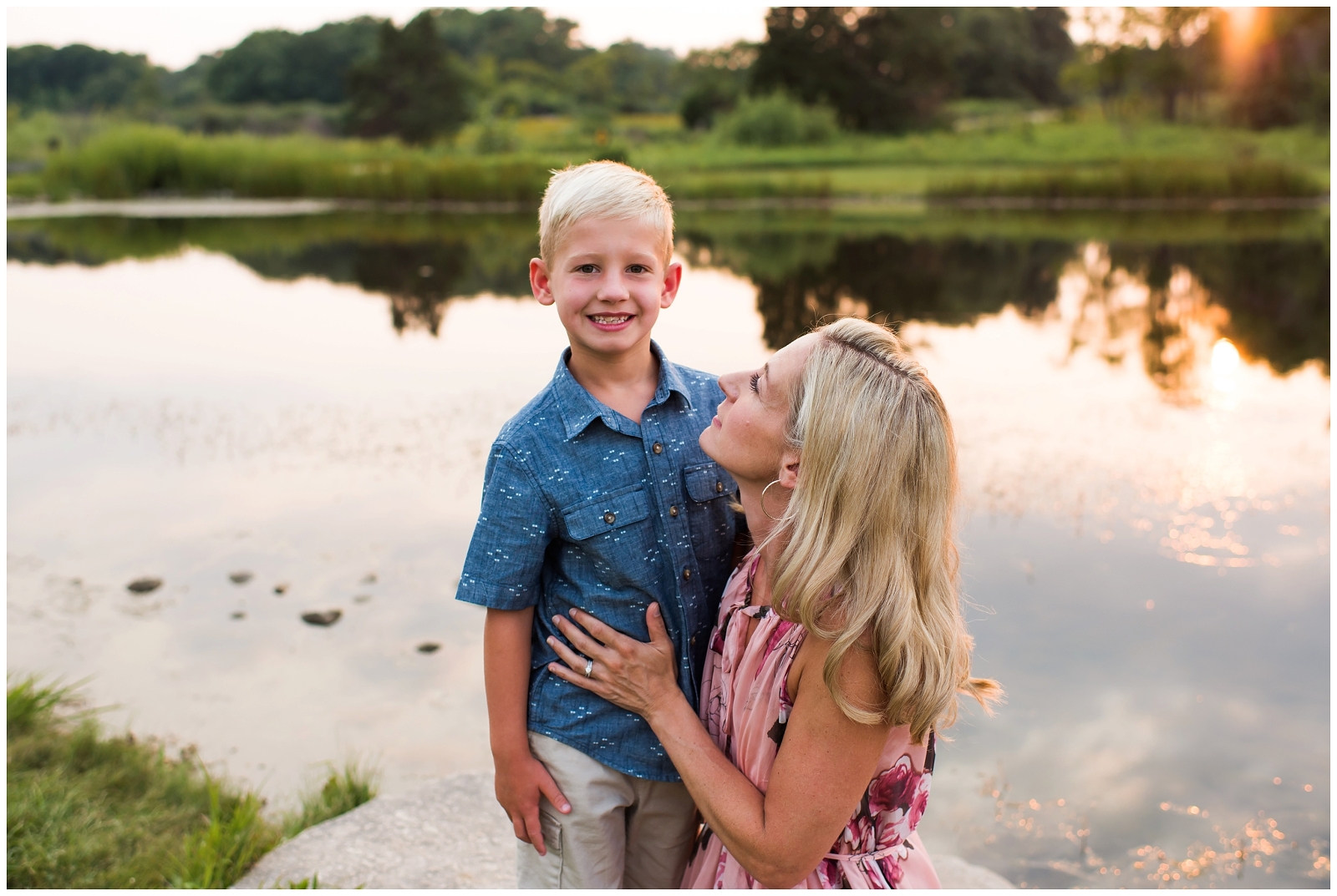 mother looking at son sunset portrait