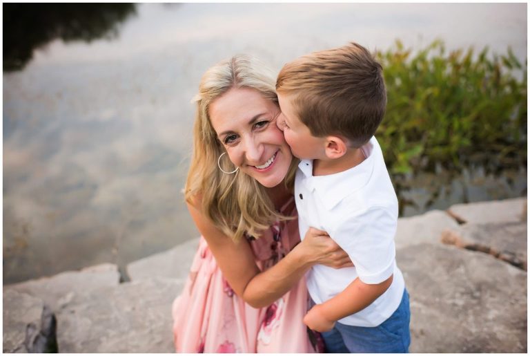 boy kissing mom's cheek